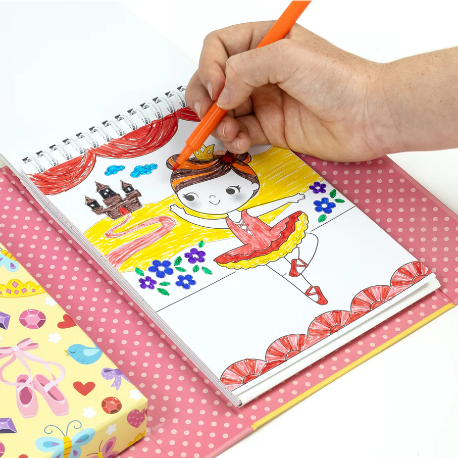 Coloring book with a princess design on a pink polka dot tablecloth.
