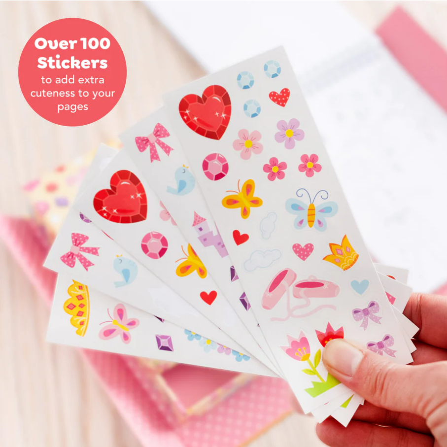 Sticker sheets with colorful designs held by a hand on a light background