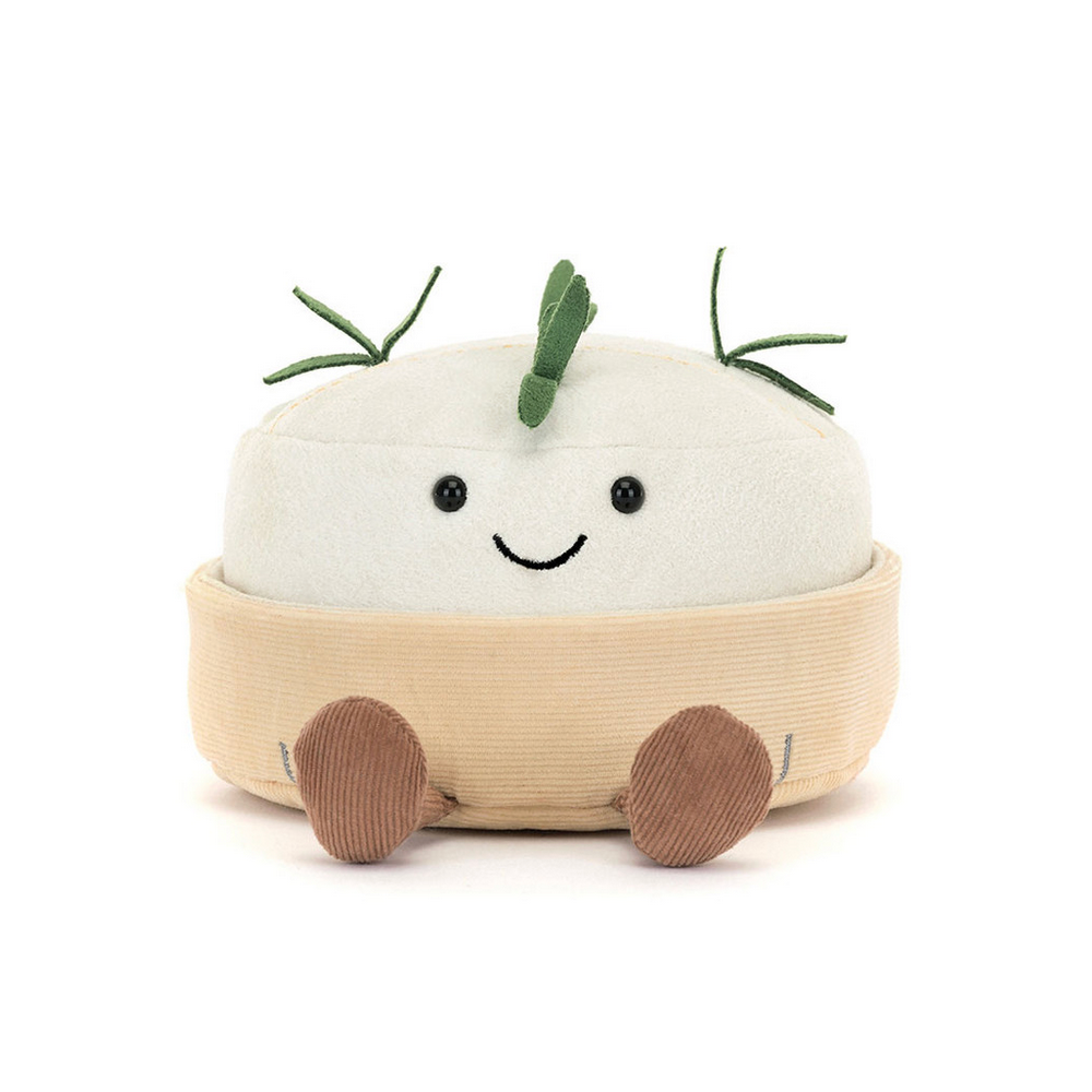 Plush toy shaped like a camembert cheese with a smiling face on a white background
