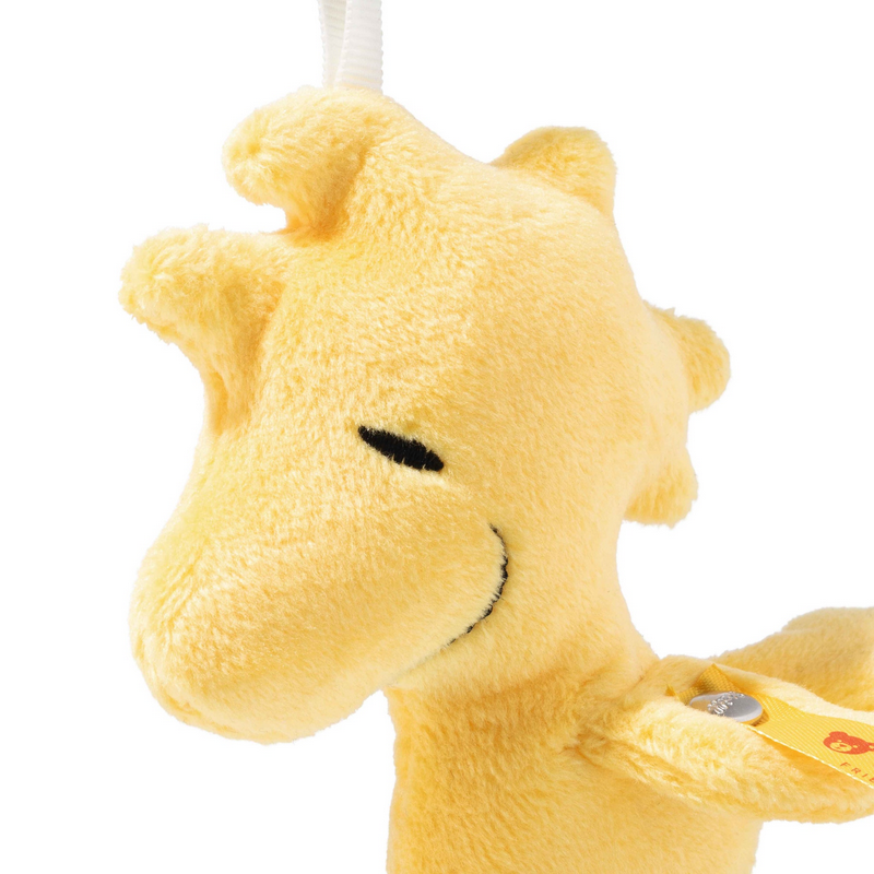 Yellow plush toy on a white background