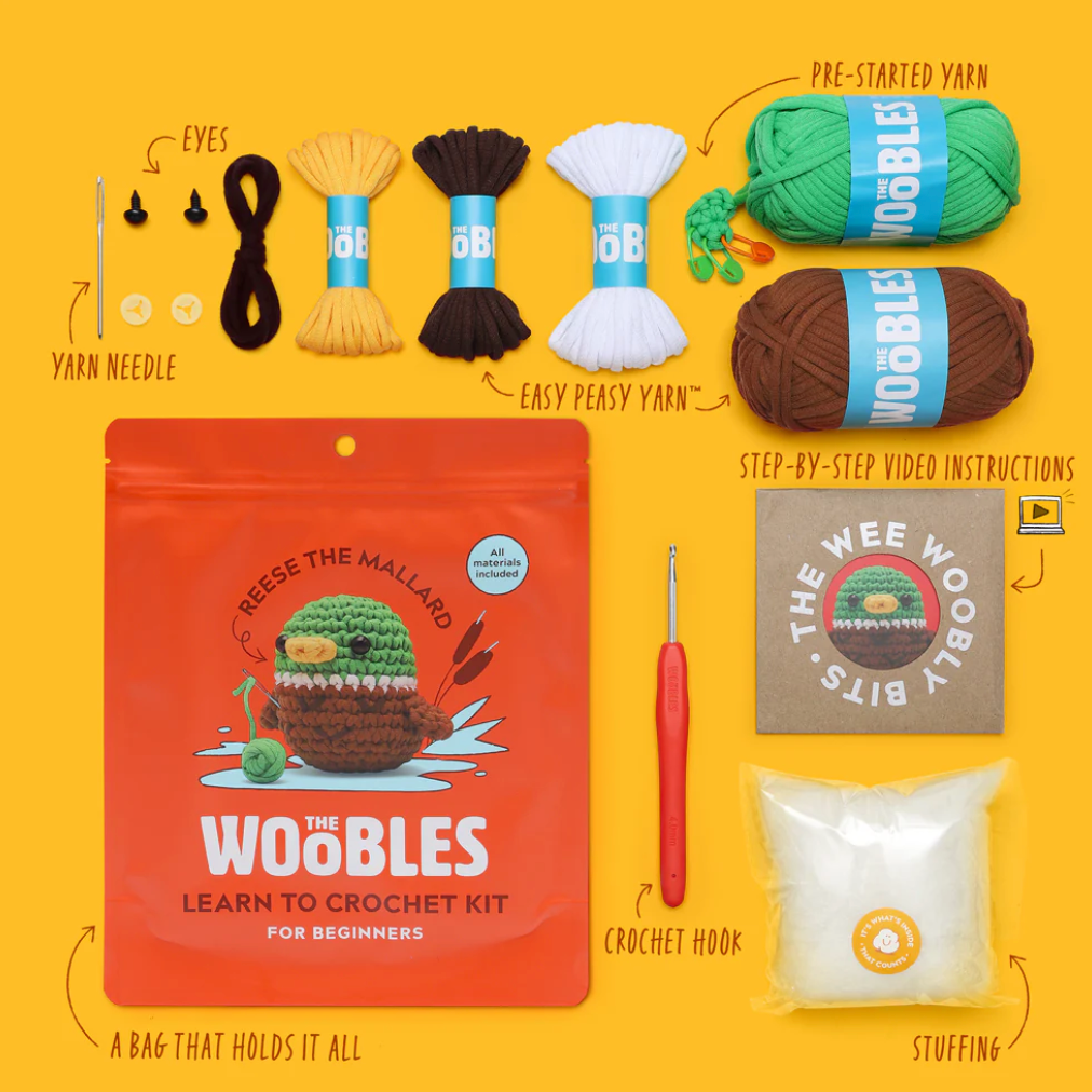 Crochet kit with various items on a yellow background