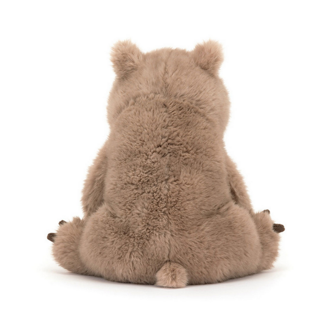 Plush toy wombat from behind on a white background