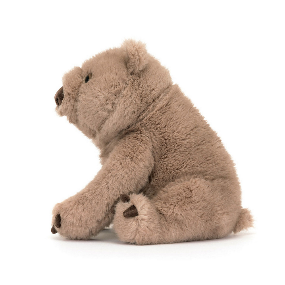 Stuffed animal wombat toy on a white background with 'Wonda Wombat' text.