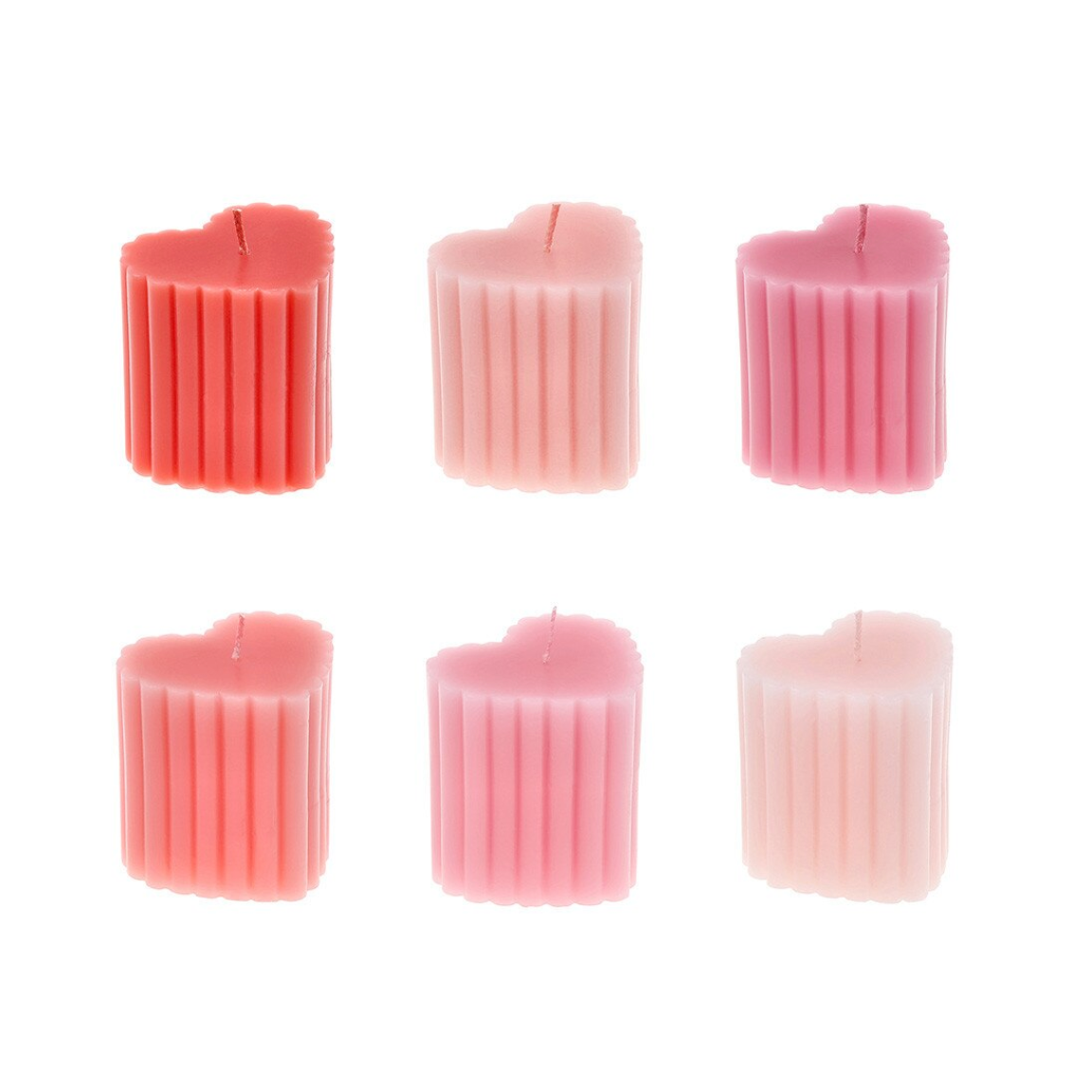 Set of six pink candles with ribbed texture on a white background