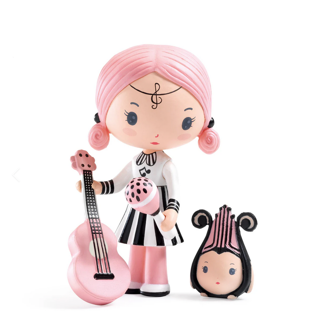 Toy figure with pink hair and black and white outfit 