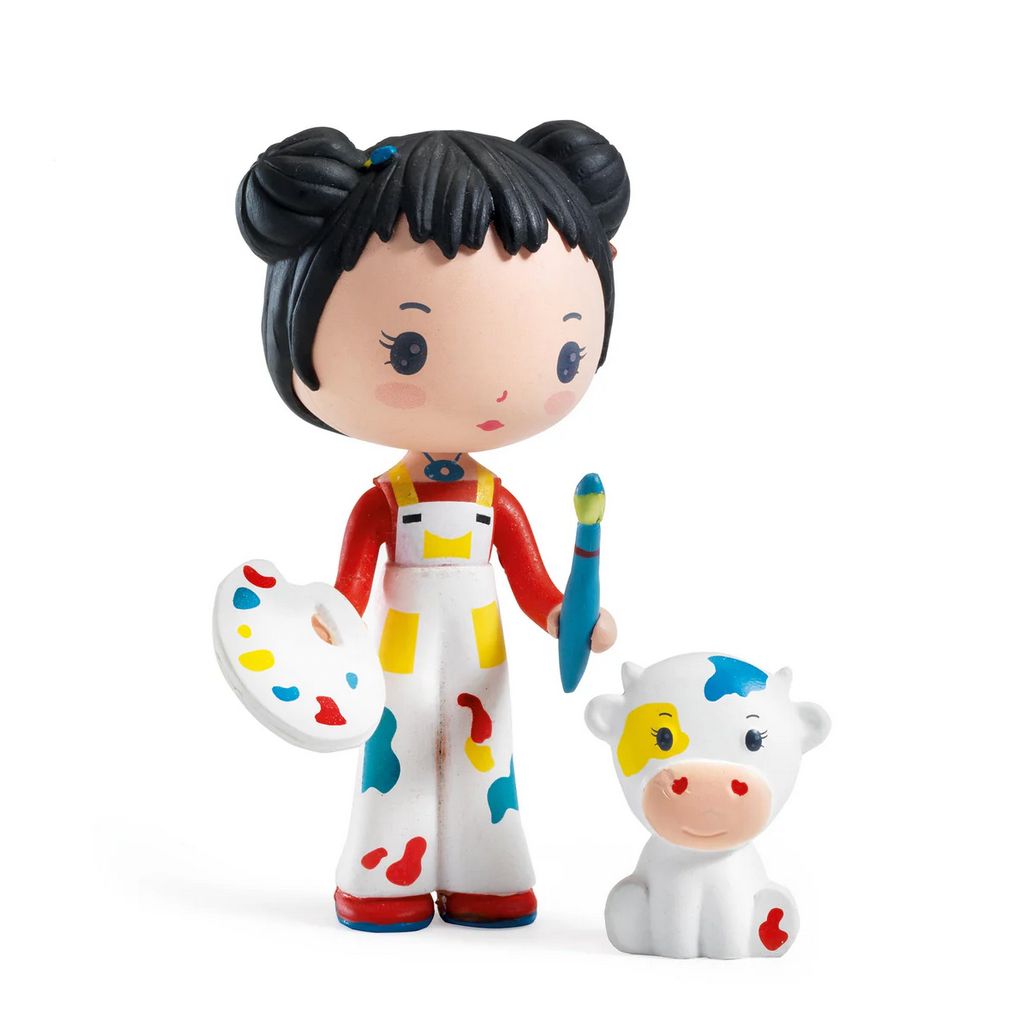 Toy figure of a girl with black hair and a cow, featuring the Djeco brand.
