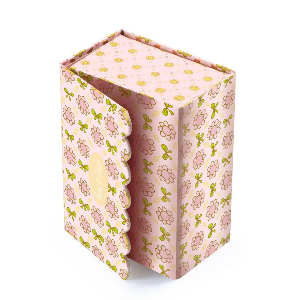 Floral-patterned toy box with DJECO branding on a white background