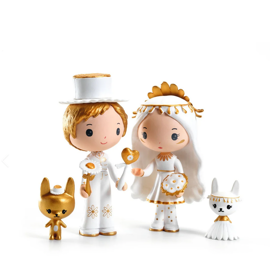 Toy figurines of a couple with two dogs on a white background, featuring the Djeco brand.
