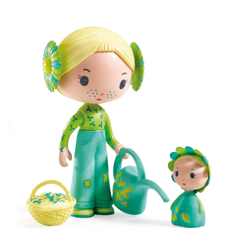 Toy figure with blonde hair and green outfit holding a watering can, with a smaller figure beside it on a white background. DJECO brand visible.