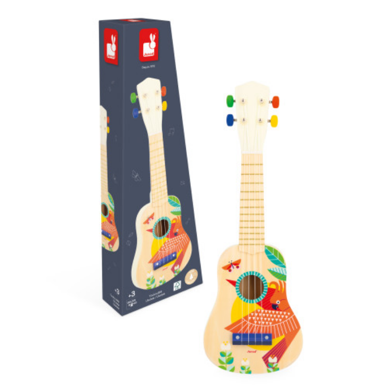 Colorful toy guitar with a matching box on a white background