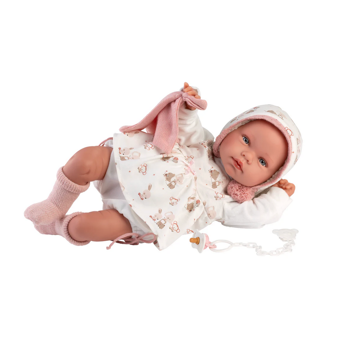Baby doll in a white outfit with pink accents on a white background