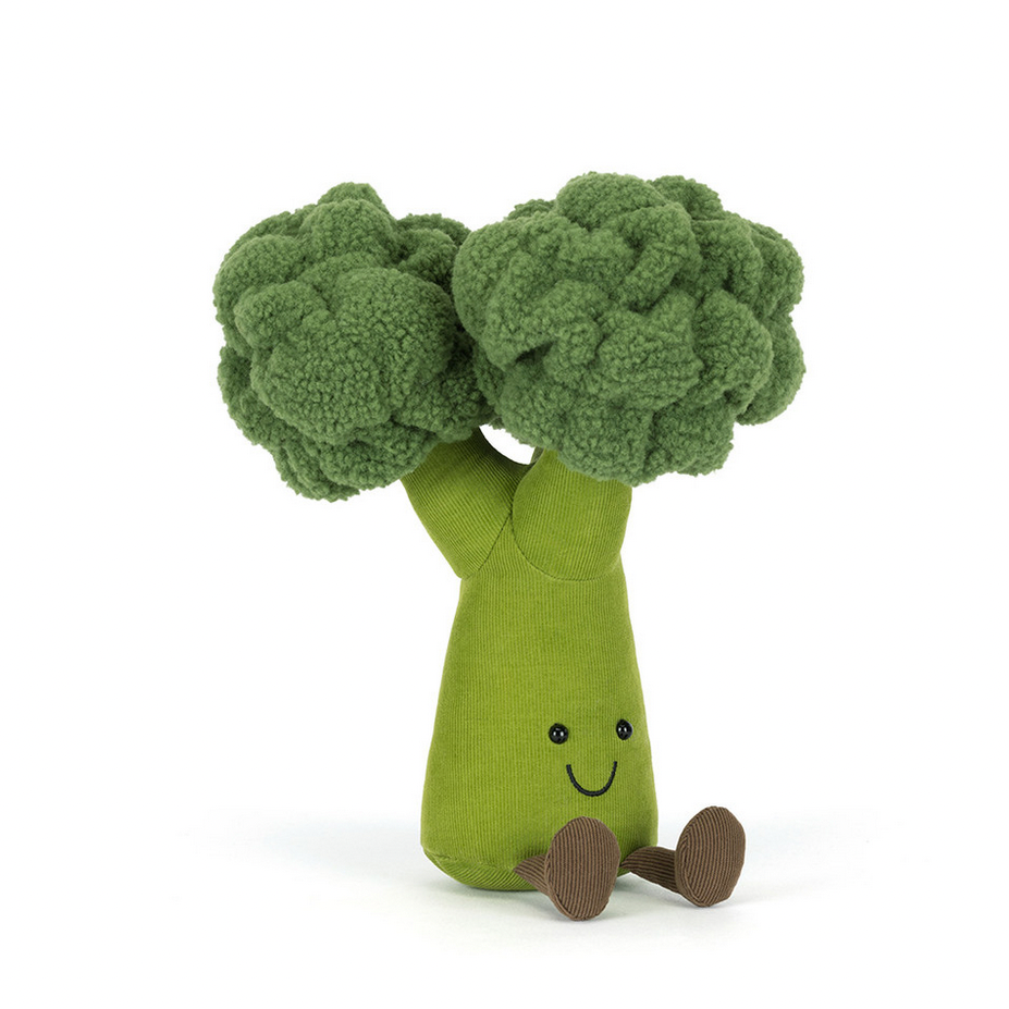 Toy broccoli with a smiling face on a white background