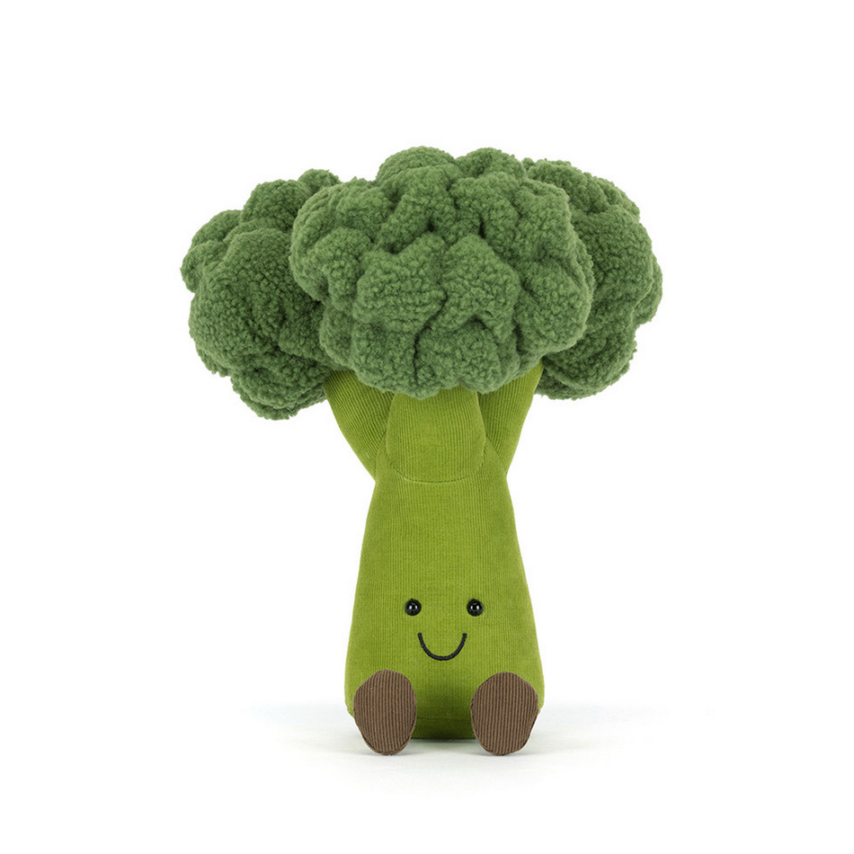 Toy broccoli with a smiling face on a white background