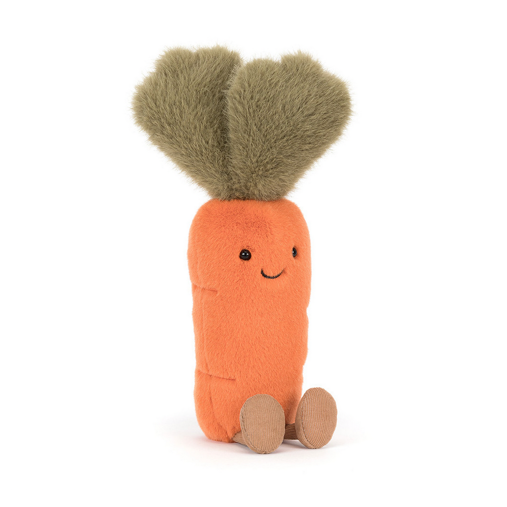 Toy carrot with a smiling face on a white background