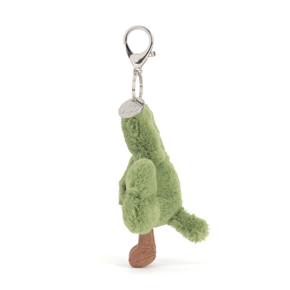 Green plush alligator keychain on a white background