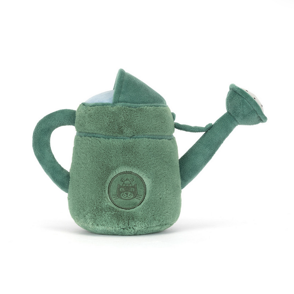 Green plush watering can toy on a white background