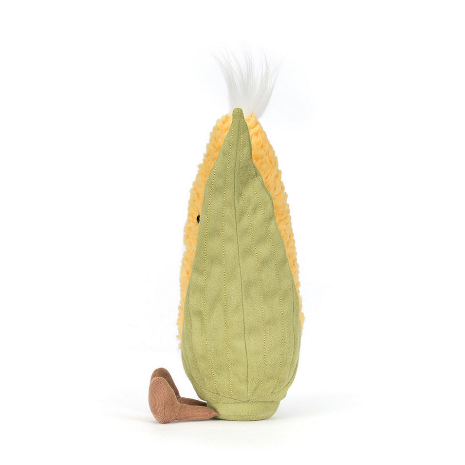 Plush toy shaped like a sweetcorn on a white background