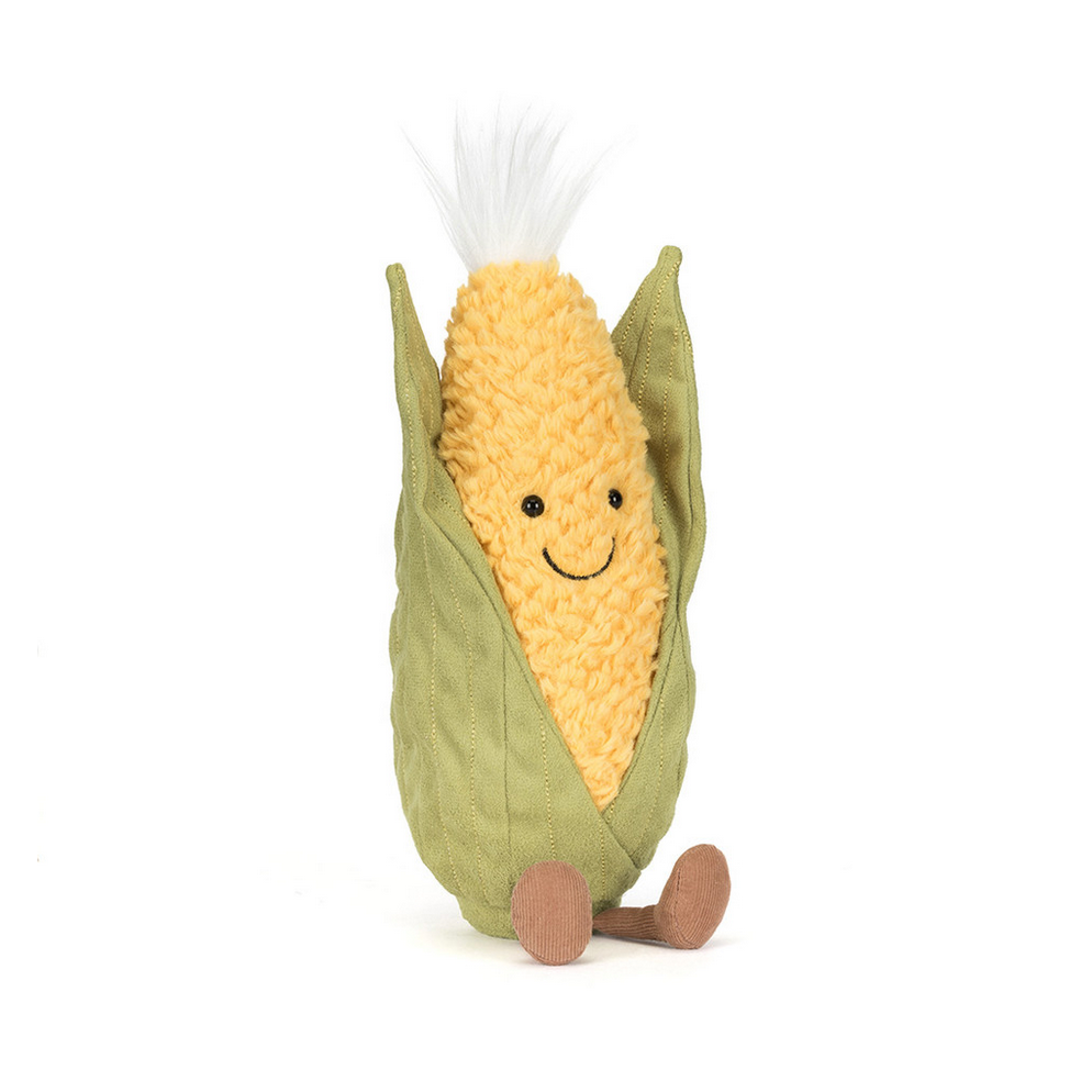 Plush toy sweetcorn with a smiling face on a white background