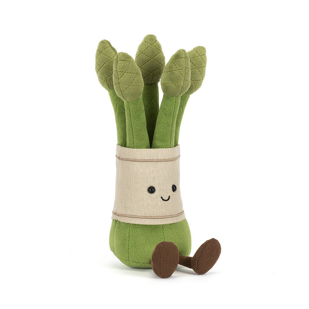 Plush toy asparagus with a smiling face on a white background