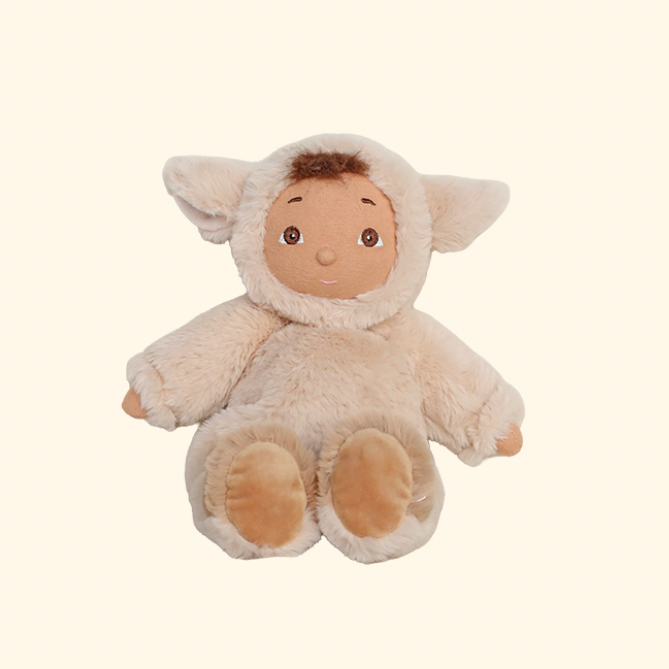 Plush toy lamb on a beige background