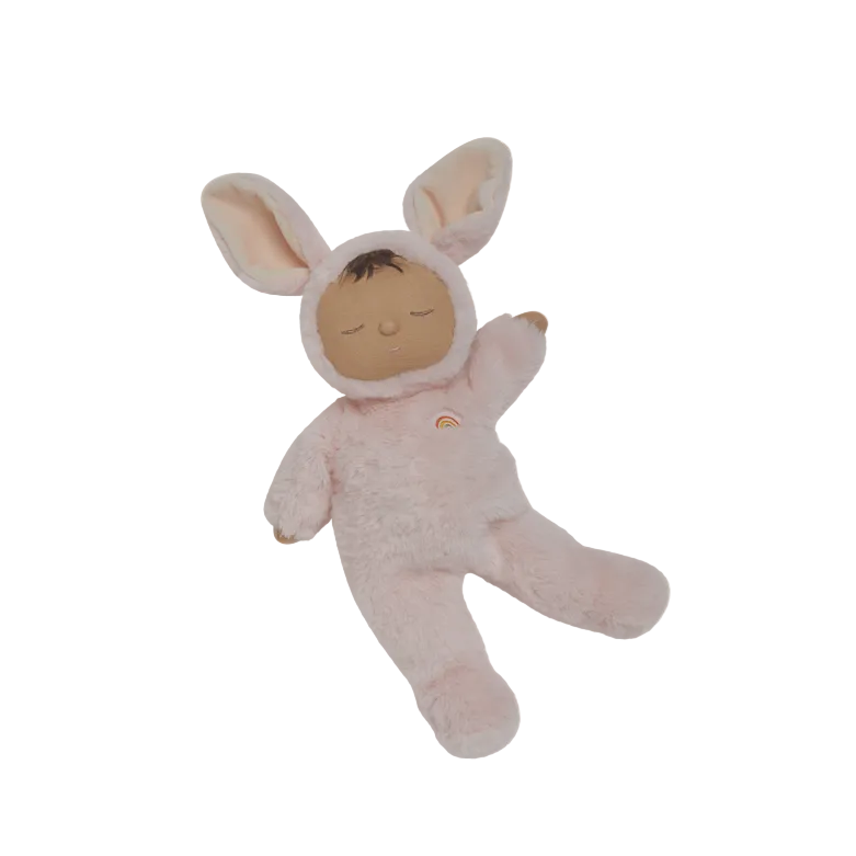 Baby doll in a bunny costume on a white background