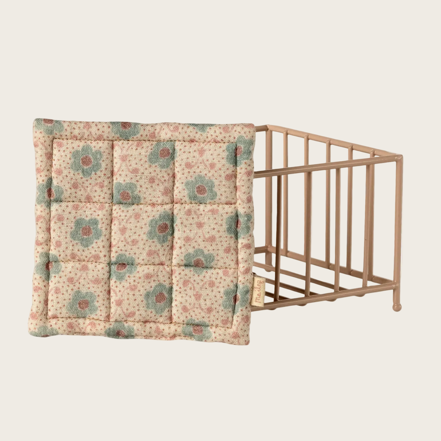 Floral-patterned crib sheet on a crib 