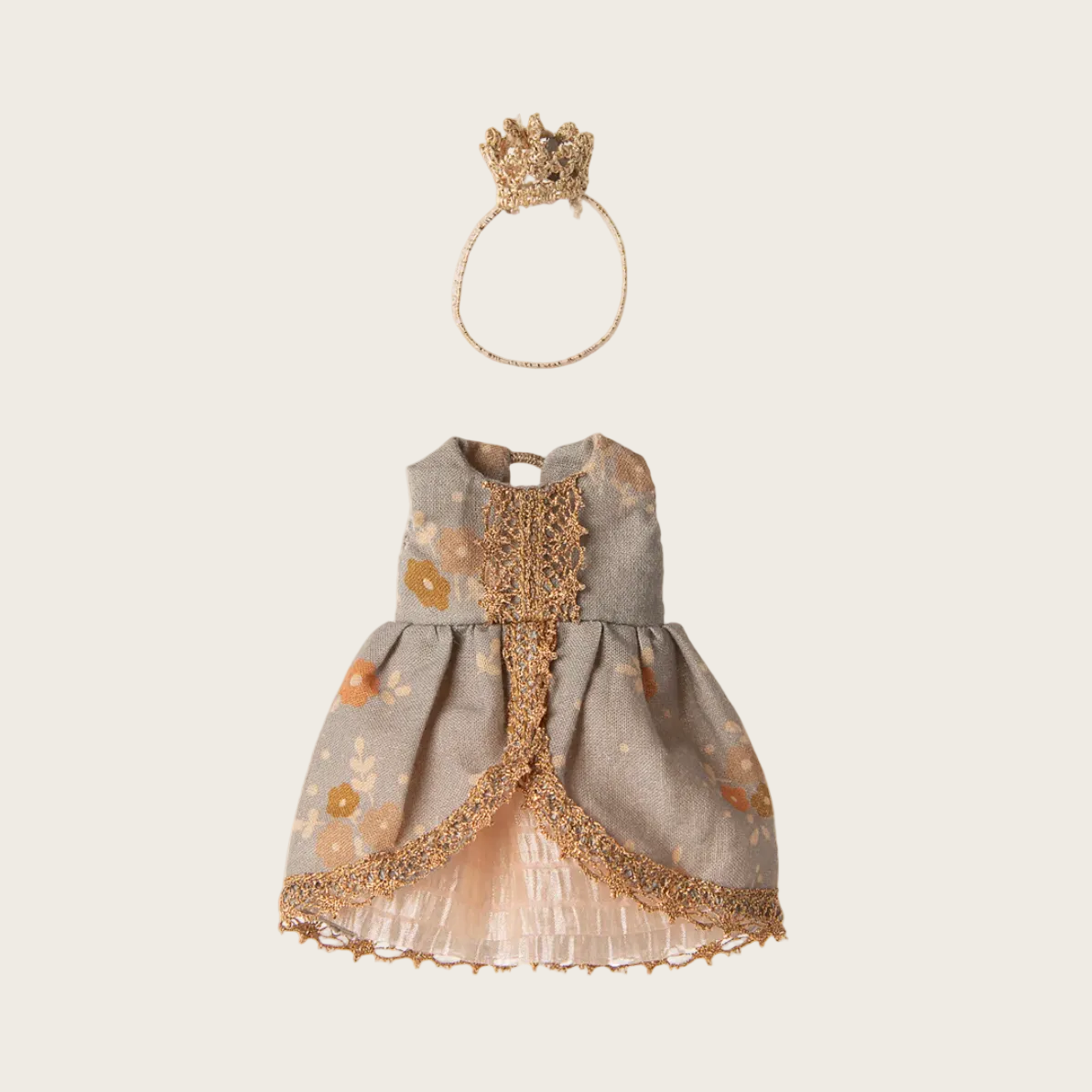 Children's dress with gold accents and a crown on a white background