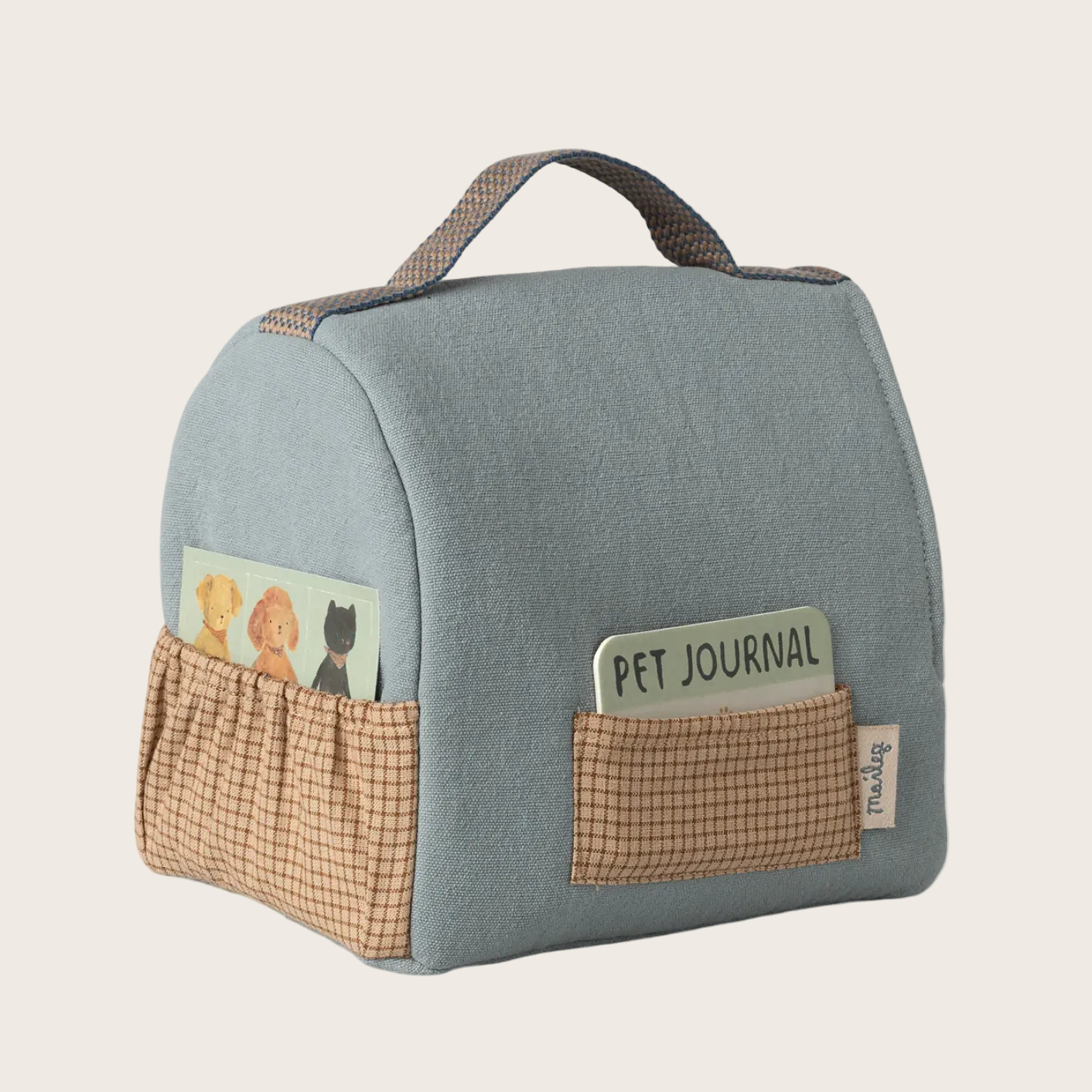 Pet carrier with a pocket labeled 'Pet Journal' on a website page.