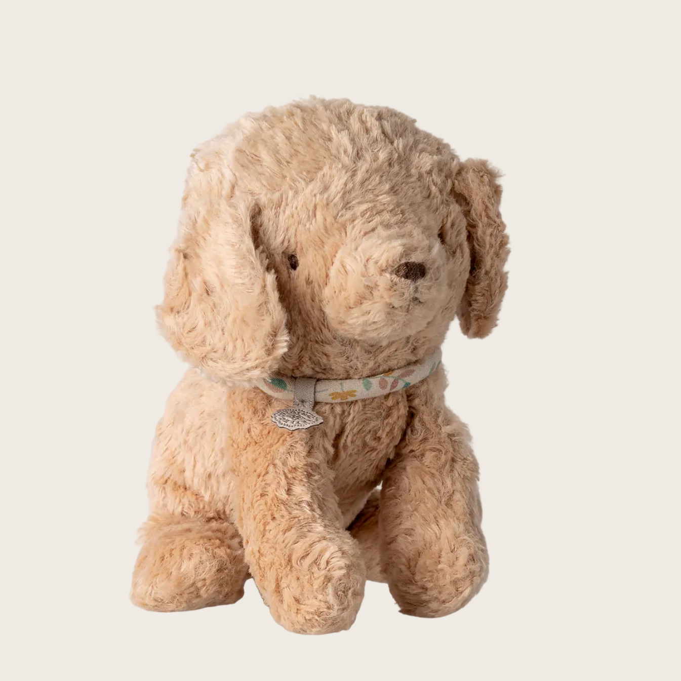 Beige stuffed dog toy 