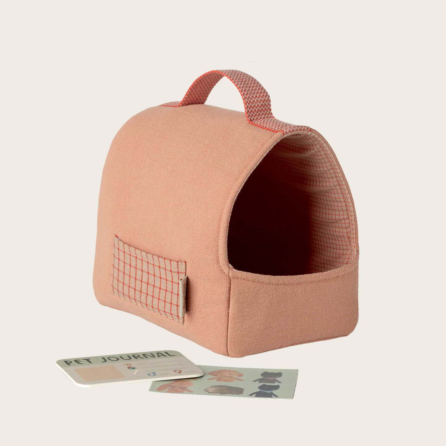 Pink pet carrier with a pet journal 