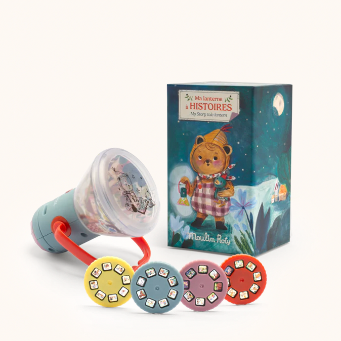 Colorful baby toy with a teddy bear book on a white background