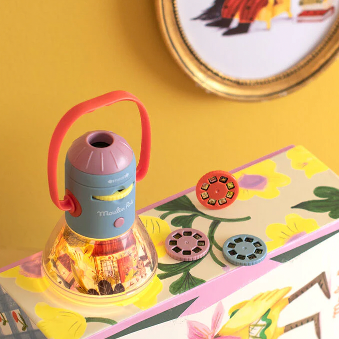 Colorful toy lantern on a decorative surface with floral patterns