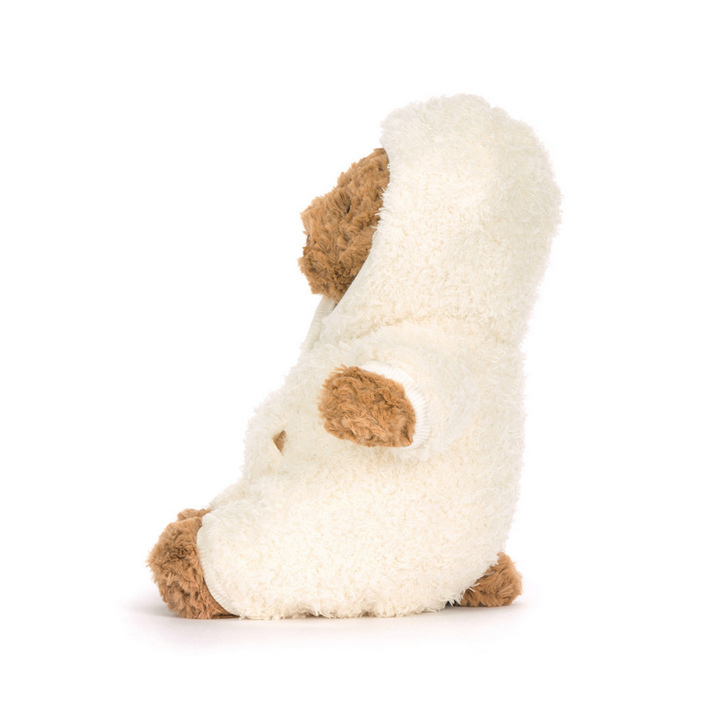 White plush toy with brown accents on a white background