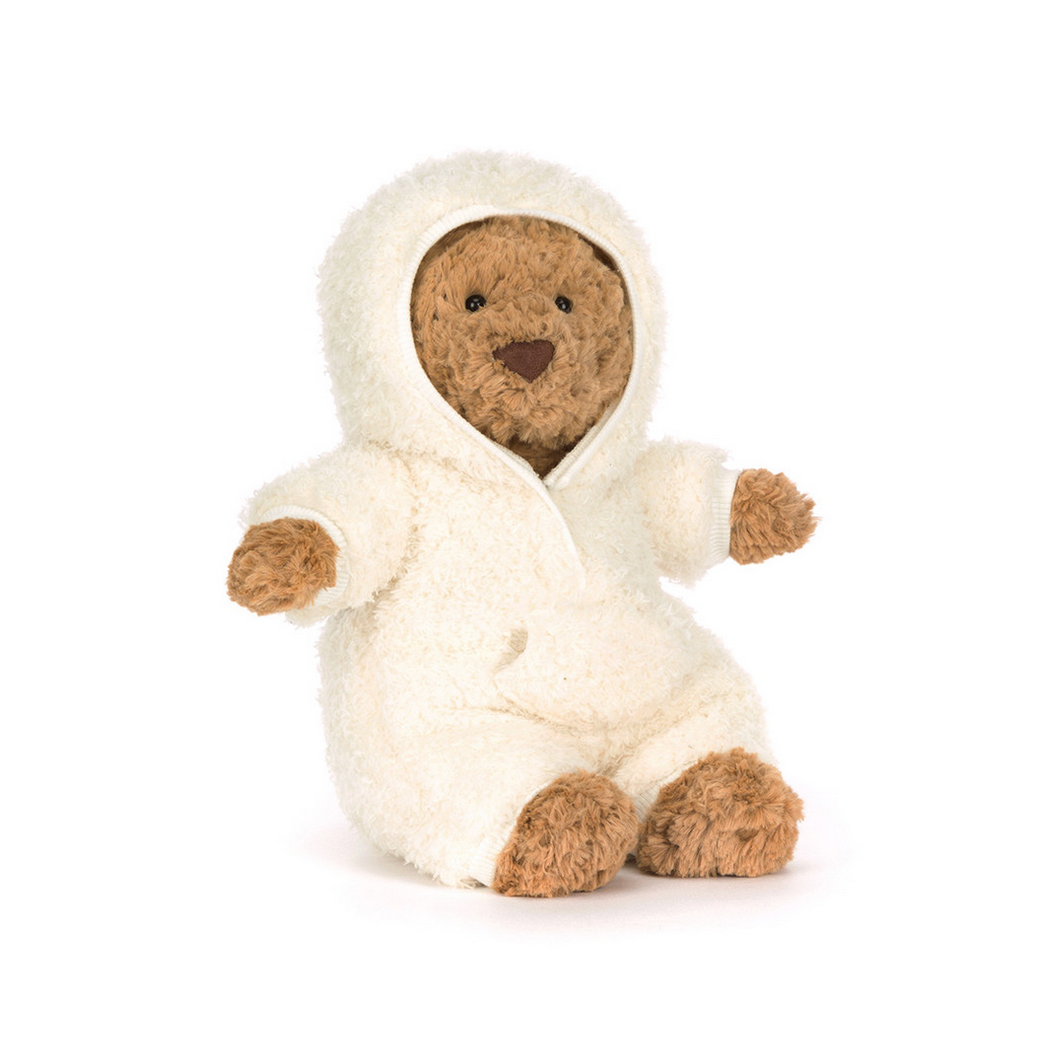 Stuffed bear in a white hooded outfit on a white background