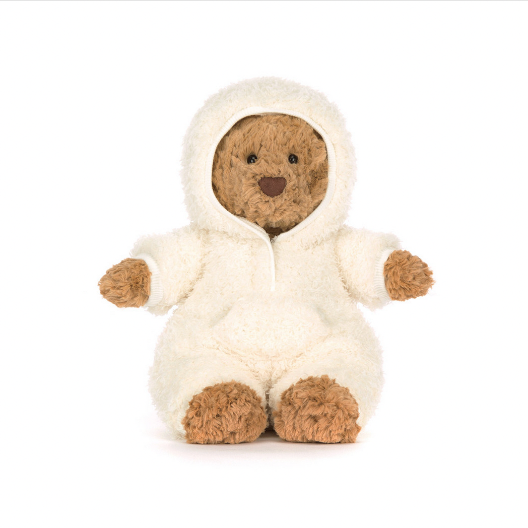 Stuffed animal toy in a white hooded outfit on a white background