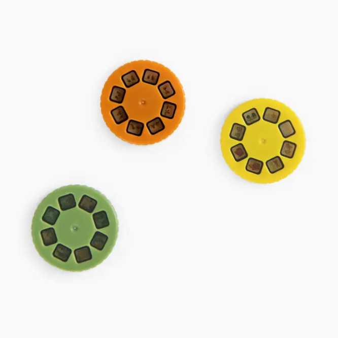 Three circular objects with a pattern of black dots on a white background