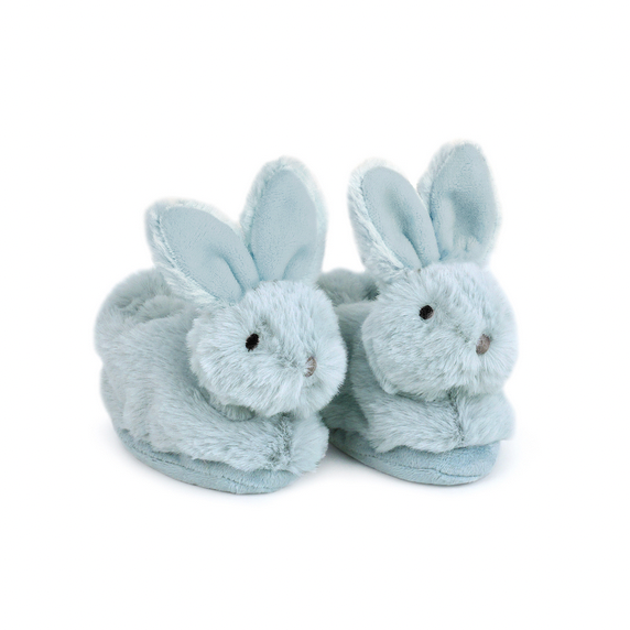 Pair of blue bunny slippers on a white background