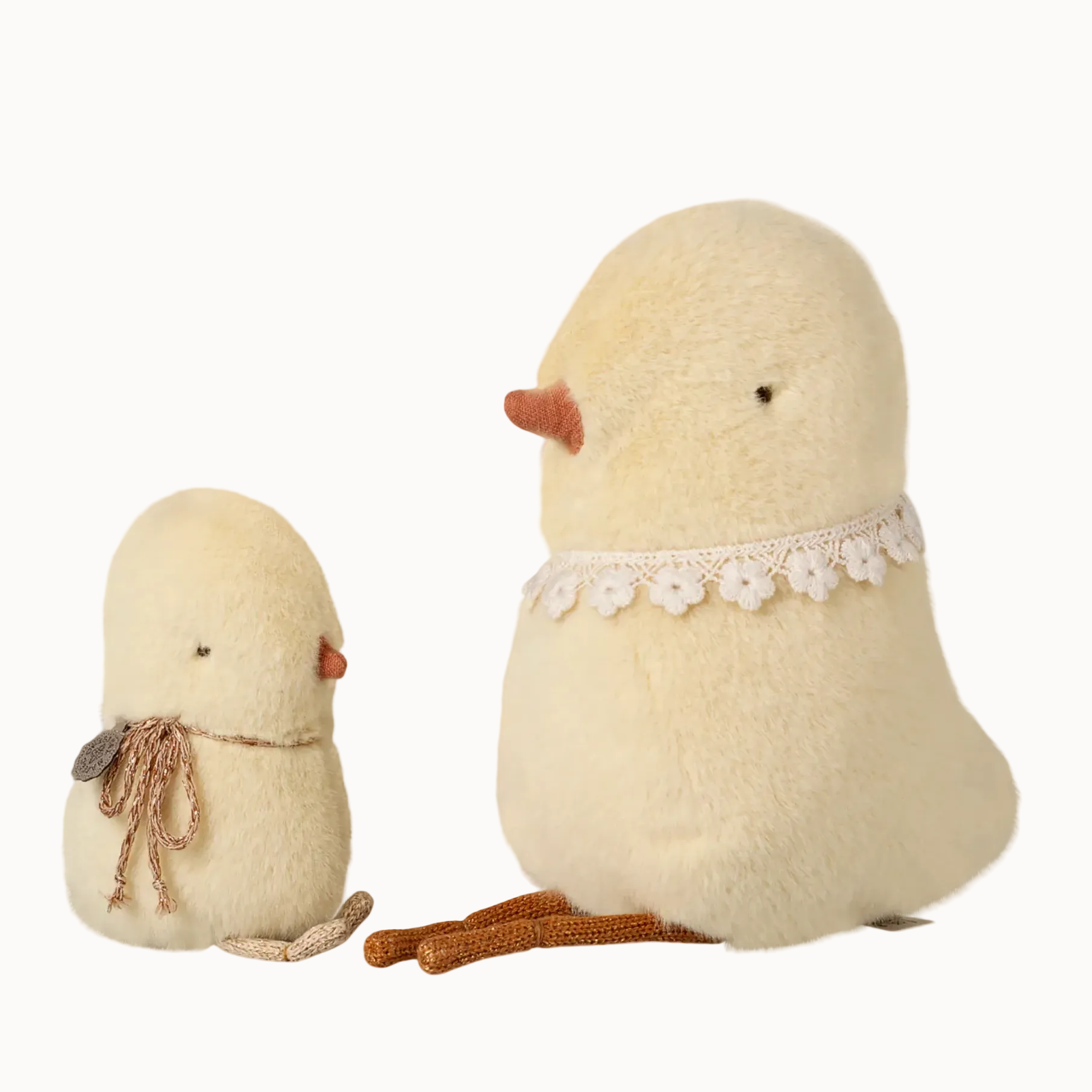 Two plush chicken toys on a white background