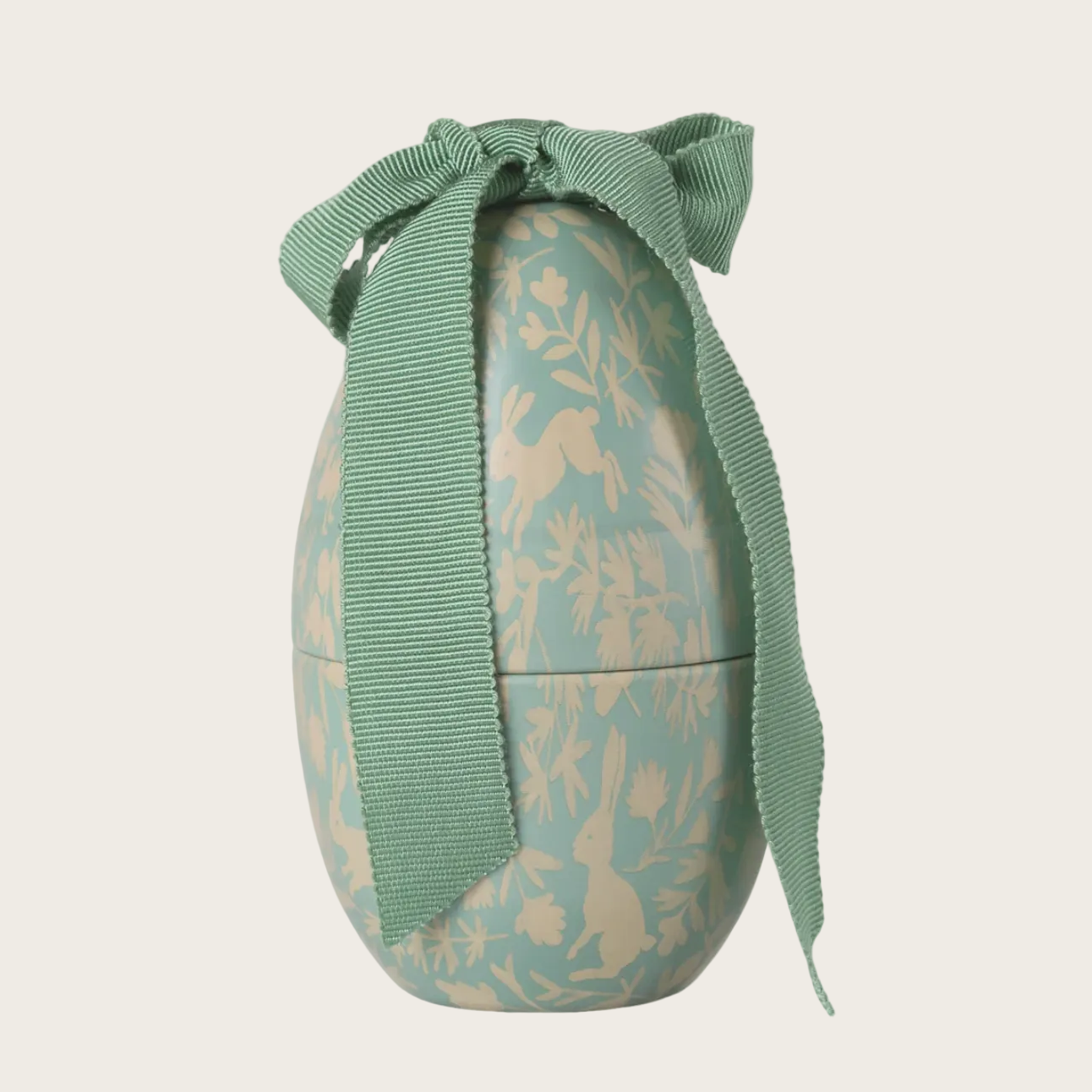Decorative Easter egg with a green ribbon 