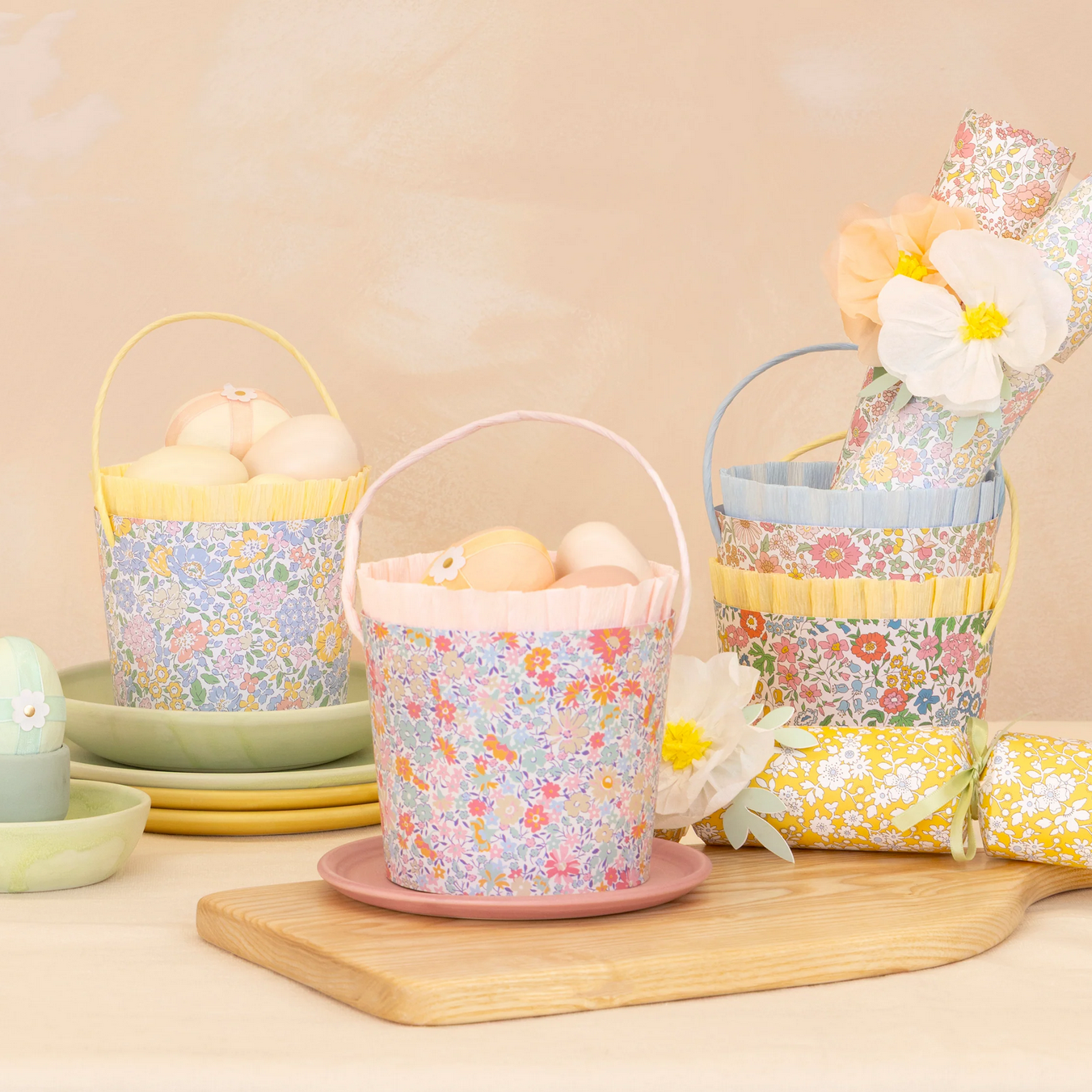 Decorative Easter baskets with eggs on a wooden surface and beige background