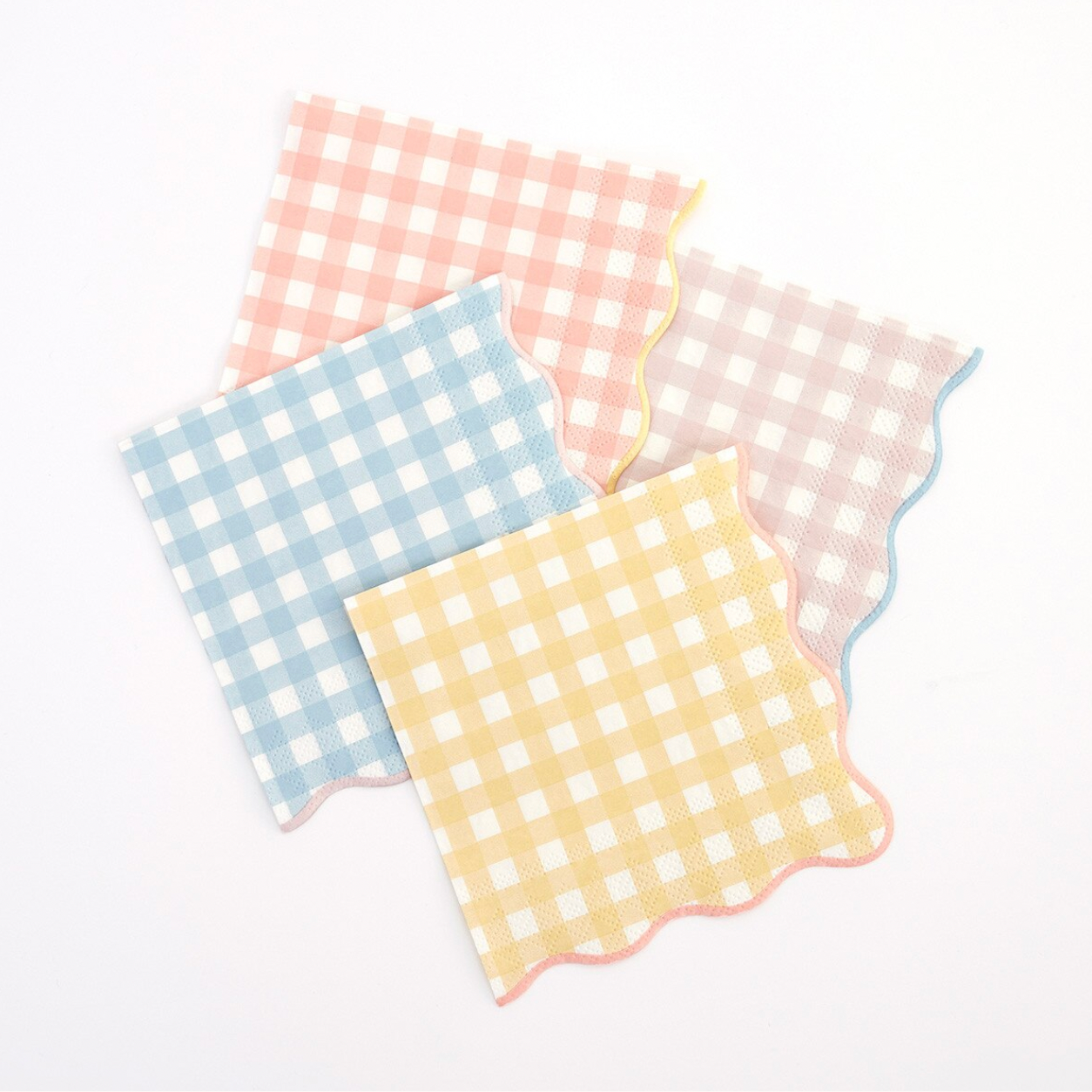 Three checkered napkins in pink, blue, and yellow on a white background
