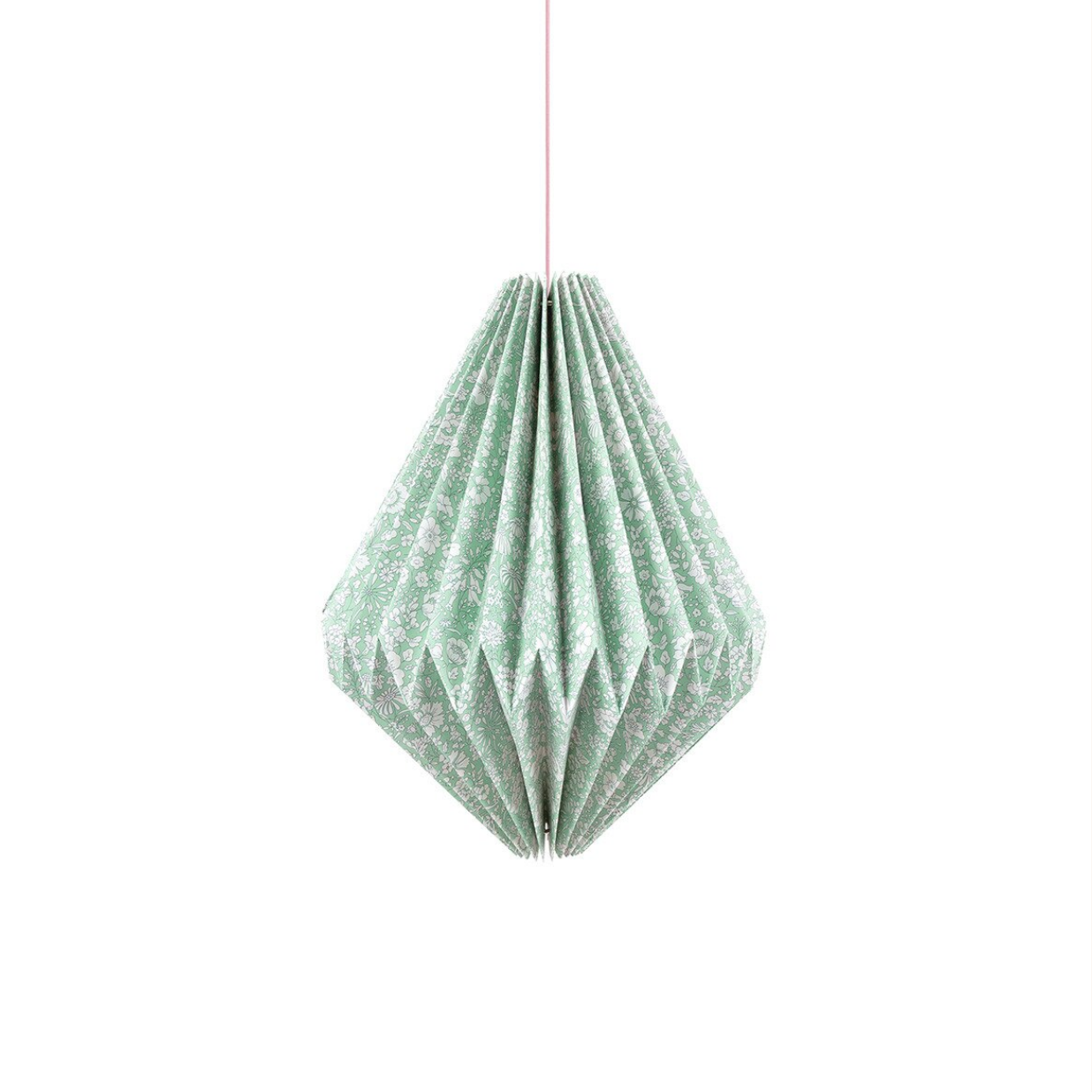 Green geometric paper lamp hanging against a white background