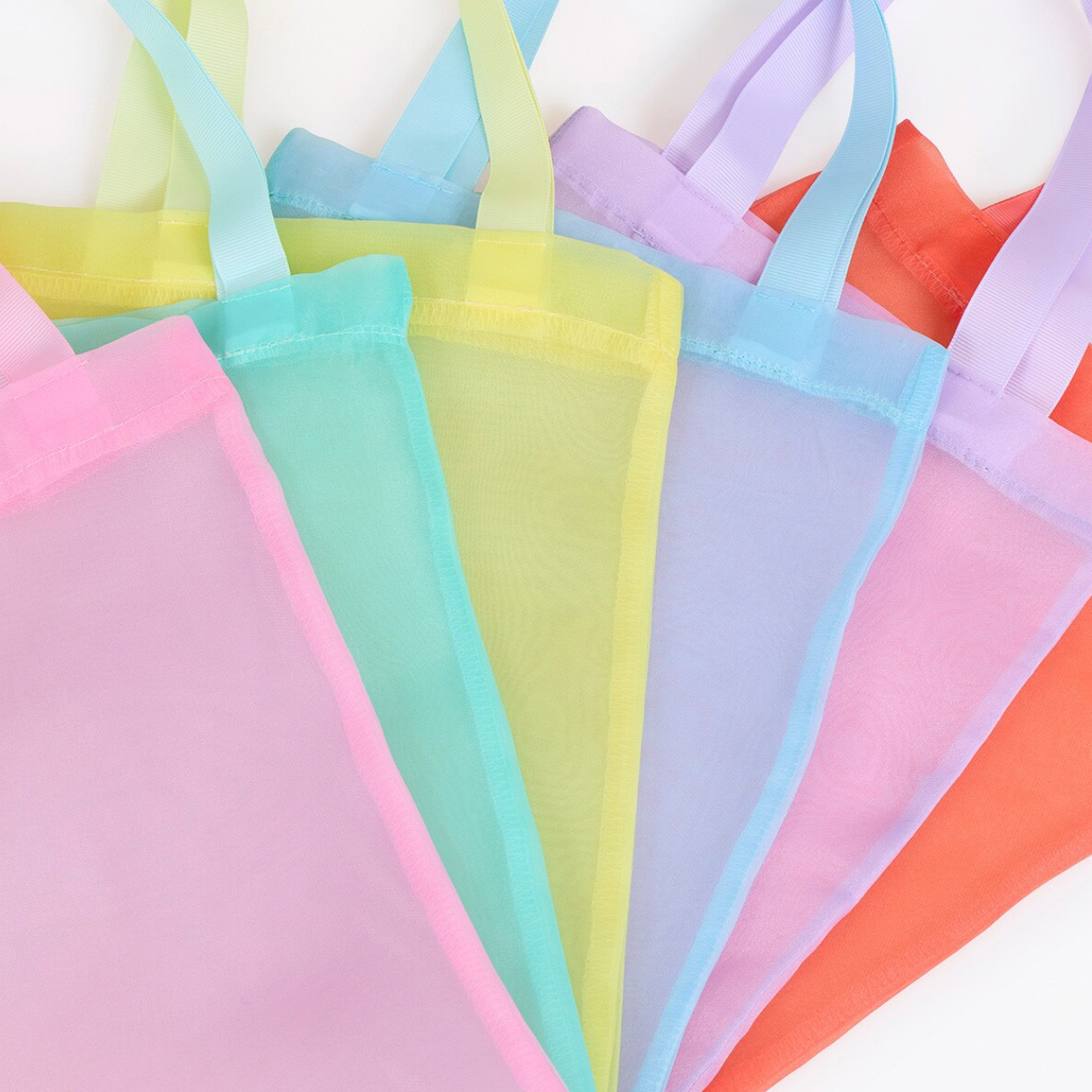 Set of colorful sheer bags on a white background