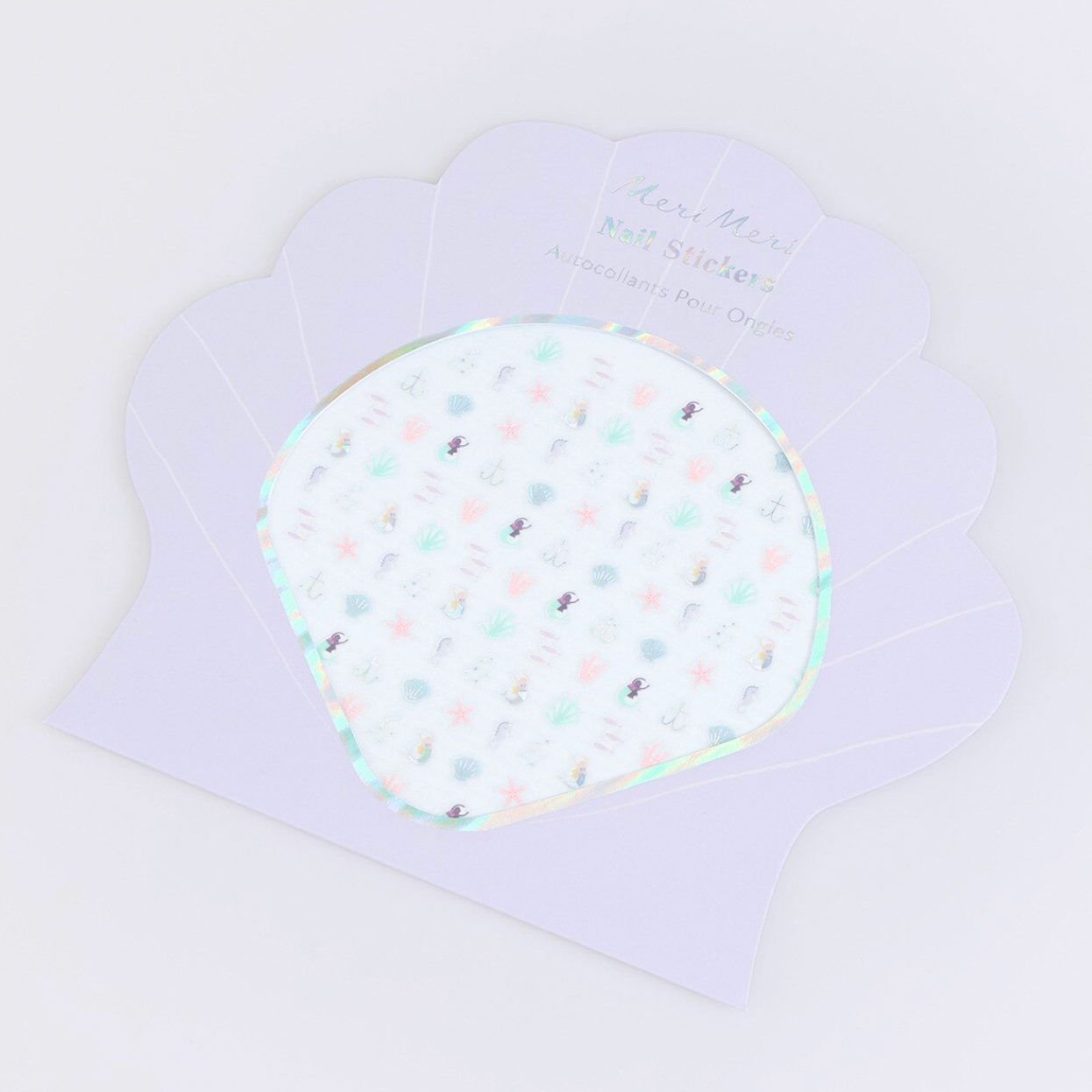 Polka dot nail stickers on a purple card with text