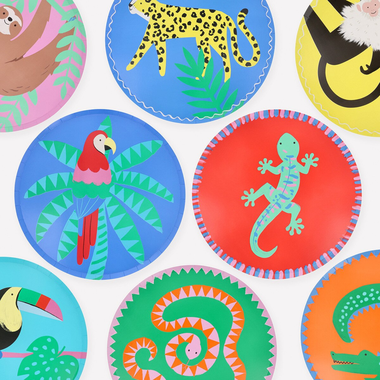 Colorful children's plates with animal illustrations on a white background