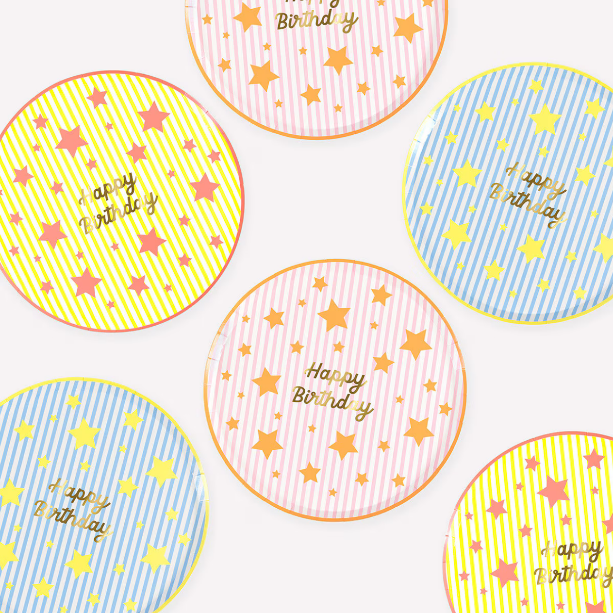 Colorful round stickers with 'Happy Birthday' text and star patterns on a white background