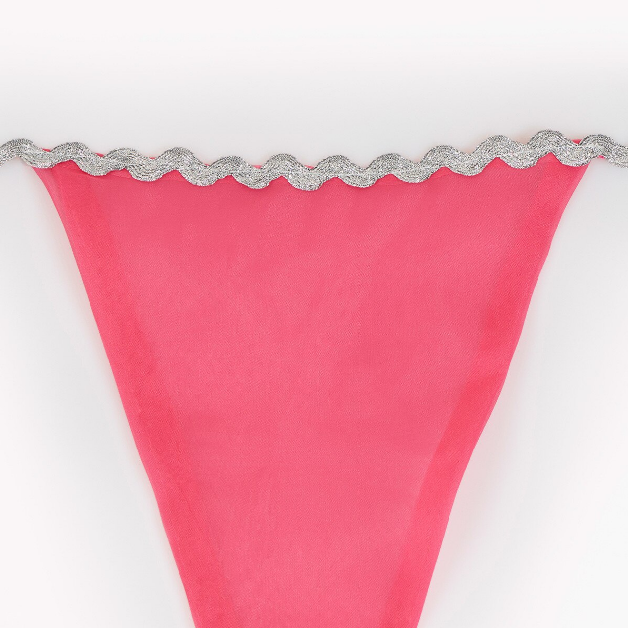 Pink fabric with silver decorative trim on a white background