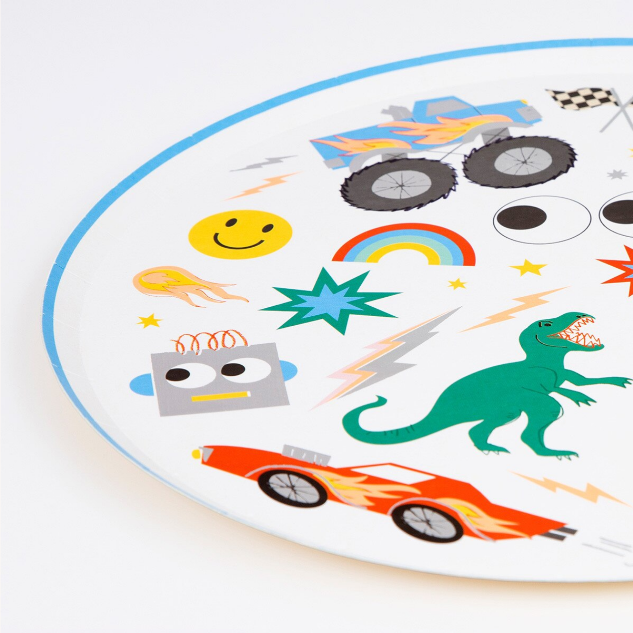 Circular plate with colorful icons including a dinosaur, car, and smiley face.
