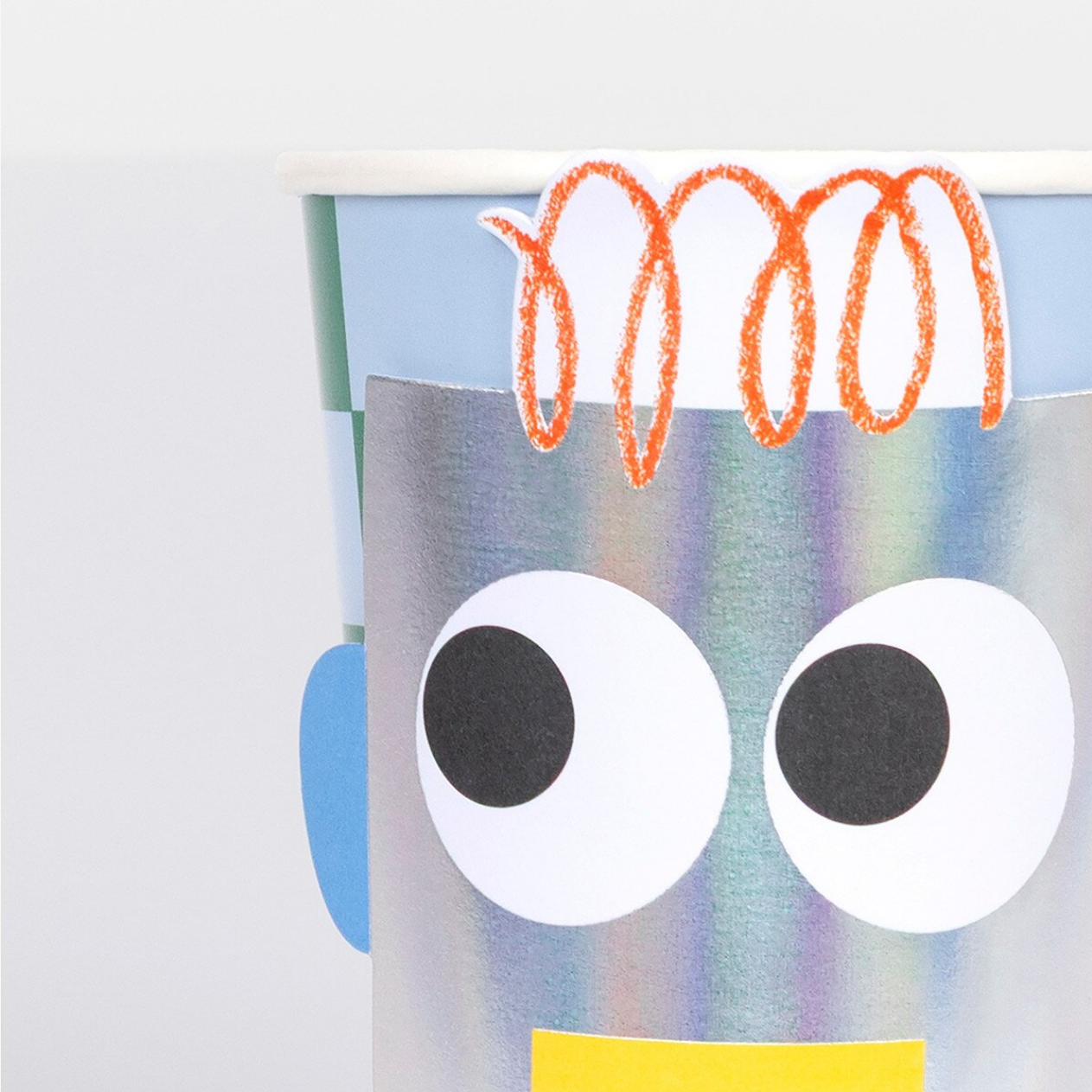 Colorful robot craft with large eyes and a simple design on a white background