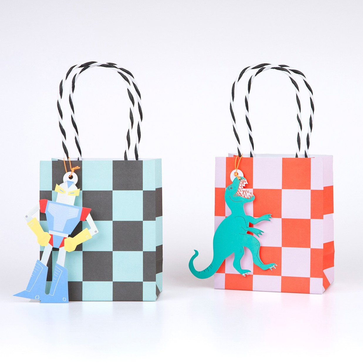 Two checkered gift bags with cartoon characters on a white background